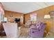 Traditional living room is furnished with plush seating and wood paneling, creating a cozy atmosphere at 701 S Dobson Rd # 259, Mesa, AZ 85202