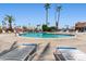 Inviting community pool with lounge chairs around the deck for relaxation and enjoyment at 701 S Dobson Rd # 259, Mesa, AZ 85202