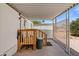 Covered porch with wooden railing offering a transition space for outdoor enjoyment at 701 S Dobson Rd # 259, Mesa, AZ 85202