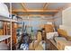 Cluttered storage unit with shelving, miscellaneous items, and storage boxes at 701 S Dobson Rd # 259, Mesa, AZ 85202