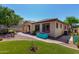 Charming home with low maintenance desert landscaping and well-manicured lawn at 7159 S Dodane Ct, Gilbert, AZ 85298