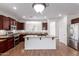 Well-lit kitchen with stainless steel appliances and granite countertops at 7159 S Dodane Ct, Gilbert, AZ 85298