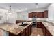 Spacious kitchen featuring granite countertops and stainless steel appliances at 7159 S Dodane Ct, Gilbert, AZ 85298