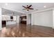 Spacious living room with wood-look flooring and natural light at 7159 S Dodane Ct, Gilbert, AZ 85298