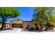 Charming single-story home featuring a well-manicured front yard and attached two-car garage at 7159 S Dodane Ct, Gilbert, AZ 85298