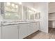 Luxurious primary bathroom with double sinks and a large walk-in shower at 7234 S 28Th Ln, Phoenix, AZ 85041