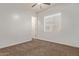 Cozy bedroom featuring neutral walls, carpet and natural light from a window at 7234 S 28Th Ln, Phoenix, AZ 85041