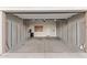 Spacious garage with ample storage cabinets, offering an organized and functional space for vehicles and equipment at 7234 S 28Th Ln, Phoenix, AZ 85041