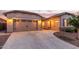Spacious three car garage with a wide driveway and meticulously landscaped yard at 7234 S 28Th Ln, Phoenix, AZ 85041