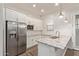 Bright kitchen features stainless steel appliances, granite countertops, and white subway tile backsplash at 7234 S 28Th Ln, Phoenix, AZ 85041
