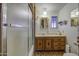 Bathroom featuring updated vanity, shower-tub combination, and natural light at 7318 E Arbor Ave, Mesa, AZ 85208