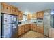 Galley-style kitchen featuring wood cabinets and a gas range cooktop at 7318 E Arbor Ave, Mesa, AZ 85208