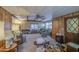 Spacious living room with a ceiling fan and cozy seating arrangements at 7318 E Arbor Ave, Mesa, AZ 85208