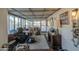 Enclosed sunroom with interior and exterior access, featuring an assortment of decor at 7318 E Arbor Ave, Mesa, AZ 85208