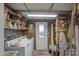 Utility room with a washer, dryer, shelving and direct access to the backyard at 7318 E Arbor Ave, Mesa, AZ 85208