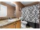 Bathroom featuring a light vanity and shower/toilet at 7778 N 51St Ln, Glendale, AZ 85301