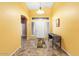 Spacious foyer with bright yellow walls, high ceiling, and tile flooring at 7778 N 51St Ln, Glendale, AZ 85301