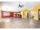 Open concept living area with tile flooring, updated lighting, and natural light at 7778 N 51St Ln, Glendale, AZ 85301
