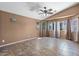 Bright living room featuring tile floors, recessed lighting and multiple windows for natural light at 7778 N 51St Ln, Glendale, AZ 85301