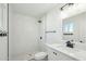 Elegant bathroom with a walk-in shower, modern fixtures, and herringbone tile at 843 N Evergreen St, Chandler, AZ 85225