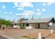 Well-kept single-story home featuring a xeriscaped front yard and covered parking at 843 N Evergreen St, Chandler, AZ 85225
