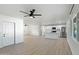 Open concept floor plan with a kitchen featuring stainless steel appliances, an island, and neutral flooring at 843 N Evergreen St, Chandler, AZ 85225