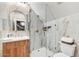 Attic bathroom with modern fixtures, glass shower door, and marble patterned walls at 87 W Windsor Ave, Phoenix, AZ 85003