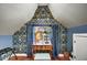 Charming bedroom features wallpapered nook, desk, and natural light from the window at 87 W Windsor Ave, Phoenix, AZ 85003
