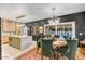 Modern dining area with sleek lighting fixture and views of the outdoor pool at 87 W Windsor Ave, Phoenix, AZ 85003