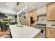 Open kitchen with a sizable island that adjoins the dining area, featuring stainless appliances at 87 W Windsor Ave, Phoenix, AZ 85003