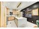 Modern kitchen featuring a large island, custom cabinetry, and stylish lighting at 87 W Windsor Ave, Phoenix, AZ 85003