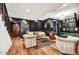 Elegant living room with dark walls, hardwood floors, and a stylish chandelier at 87 W Windsor Ave, Phoenix, AZ 85003