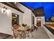 Charming porch featuring a seating area with patterned tile flooring and exterior lighting at 87 W Windsor Ave, Phoenix, AZ 85003