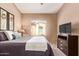 Comfortable bedroom shows soft bedding, warm walls, and natural light at 900 S 94Th St # 1166, Chandler, AZ 85224