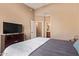 Well-lit bedroom features a view of the entry to the bathroom at 900 S 94Th St # 1166, Chandler, AZ 85224