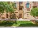 Inviting front exterior showcases the charming architecture and well-maintained landscaping of this beautiful townhouse at 900 S 94Th St # 1166, Chandler, AZ 85224