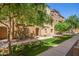 Attractive exterior view of the townhouses in a well-maintained community with green landscaping at 900 S 94Th St # 1166, Chandler, AZ 85224