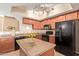 Updated kitchen shows a view of the island and stylish black appliances at 900 S 94Th St # 1166, Chandler, AZ 85224