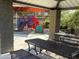 Shaded playground featuring colorful slides and climbing structures, seen from the sheltered picnic area for community enjoyment at 900 S 94Th St # 1166, Chandler, AZ 85224
