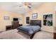 Primary bedroom suite with a vaulted ceiling, carpet flooring, and plenty of natural light at 9309 E Obispo Ave, Mesa, AZ 85212