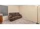 Living room with a carpet floor and a comfortable sofa at 9309 E Obispo Ave, Mesa, AZ 85212