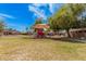Local playground with a covered play area and views of surrounding homes and neighborhood at 9309 E Obispo Ave, Mesa, AZ 85212