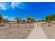 Community walking path featuring gravel landscaping and a bright blue sky at 9309 E Obispo Ave, Mesa, AZ 85212