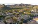 Beautiful property in a tranquil neighborhood, featuring a sparkling pool and lush landscaping at 9548 E Kiva Ln, Gold Canyon, AZ 85118