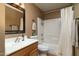 Cozy bathroom with a sink, a toilet, and a shower with a white shower curtain at 9548 E Kiva Ln, Gold Canyon, AZ 85118