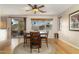 Bright dining room features a round table, natural light, and hardwood floors at 9548 E Kiva Ln, Gold Canyon, AZ 85118