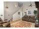 Spacious living room features hardwood floors, leather furniture, and staircase at 9548 E Kiva Ln, Gold Canyon, AZ 85118