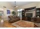 Comfortable living room with leather sofa and hardwood floors at 9548 E Kiva Ln, Gold Canyon, AZ 85118