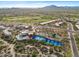 Overhead shot showcasing community amenities including a swimming pool and tennis courts at 9566 E Raindance Trl, Scottsdale, AZ 85262