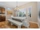 Elegant dining room with bright window views and modern chandelier at 9566 E Raindance Trl, Scottsdale, AZ 85262